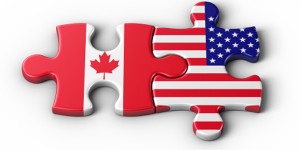 Canada and United States flags joined as puzzle pieces